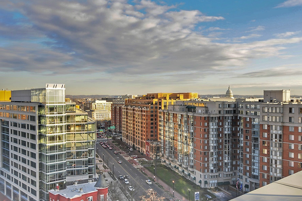 Street view during a beautiful sunset of Mt Vernon Square and condominiums for sale